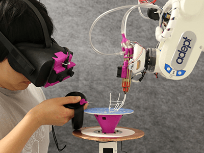 RoMA: Interactive Fabrication with Augmented Reality and a Robotic 3D Printer